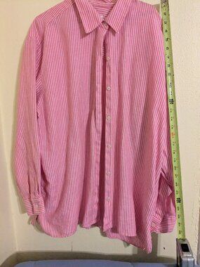 Pink and white shirt.
